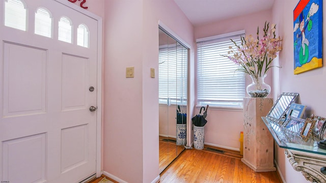 entryway with light hardwood / wood-style flooring