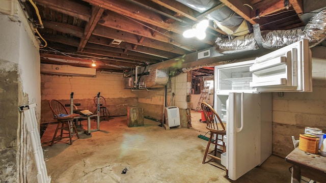 basement with white refrigerator and electric panel