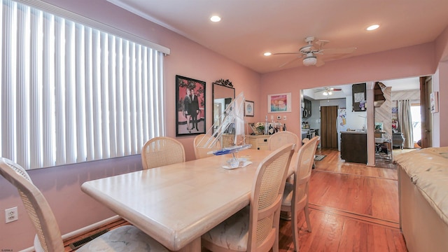 dining area featuring ceiling fan and light wood-type flooring