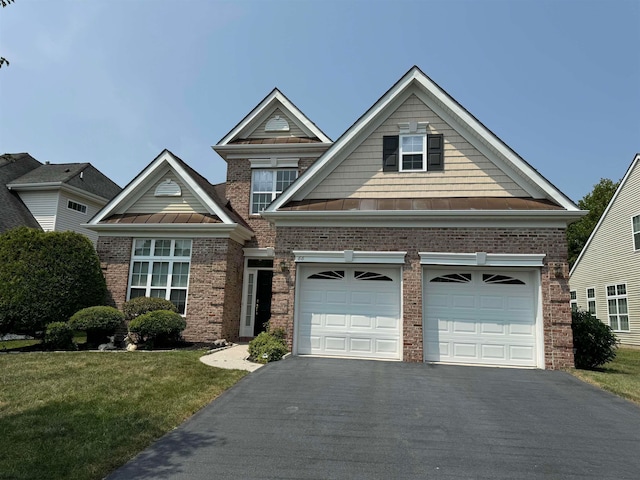 view of front of property featuring a garage and a front yard