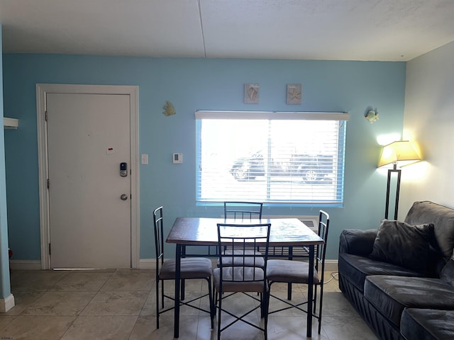 dining area with light tile patterned floors