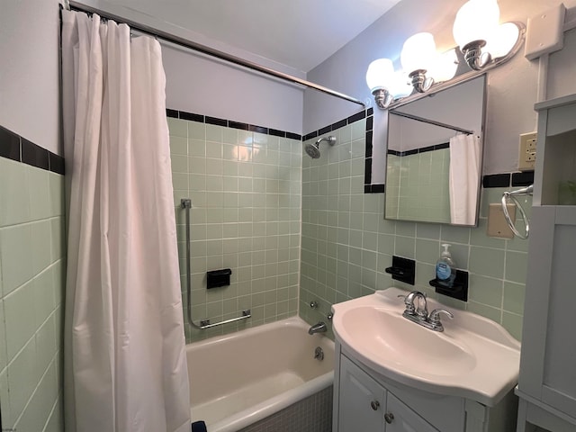 bathroom with shower / bathtub combination with curtain, tile walls, backsplash, and vanity