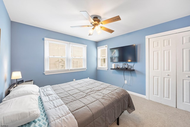 bedroom featuring carpet floors, ceiling fan, and a closet