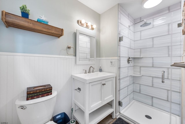 bathroom with vanity, toilet, and an enclosed shower