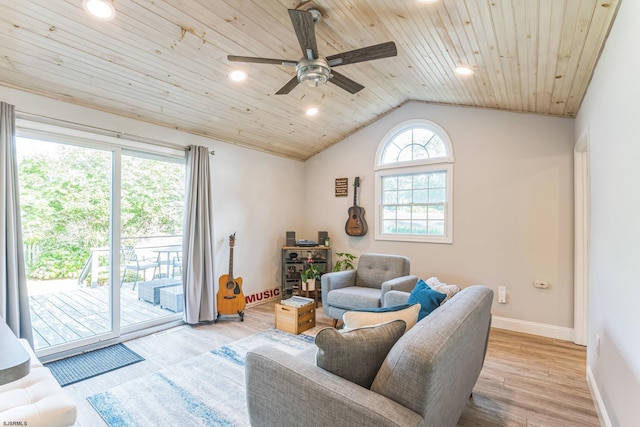 living room with wood ceiling, vaulted ceiling, ceiling fan, and light hardwood / wood-style flooring