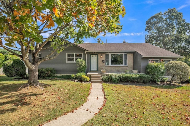 single story home with a front lawn