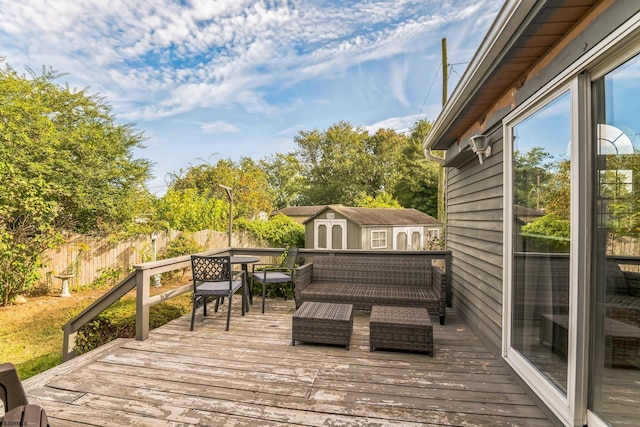 wooden deck featuring a storage unit