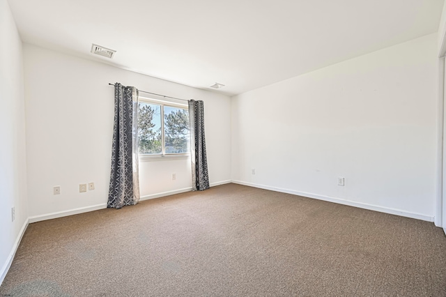 unfurnished room with carpet flooring