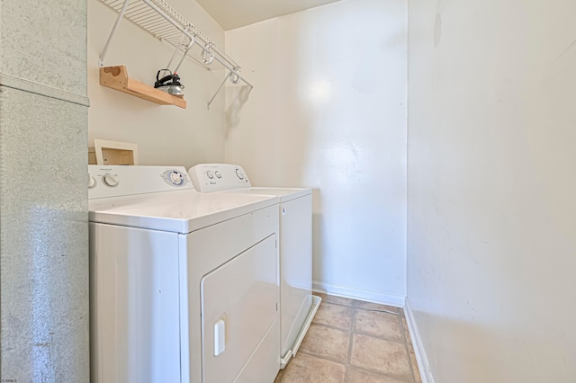 laundry room with separate washer and dryer