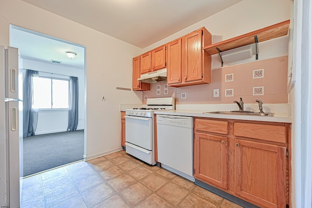 kitchen featuring sink, white appliances, and decorative backsplash