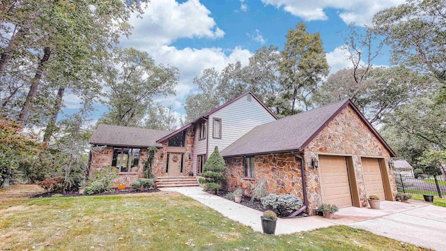 view of front of house featuring a garage and a front lawn