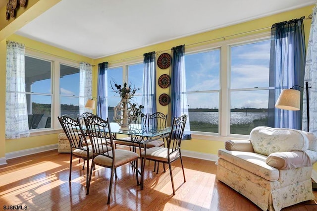 sunroom with a water view