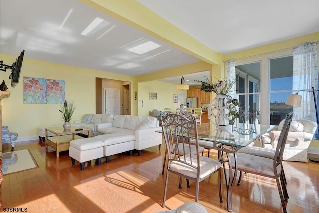 dining room with light hardwood / wood-style flooring