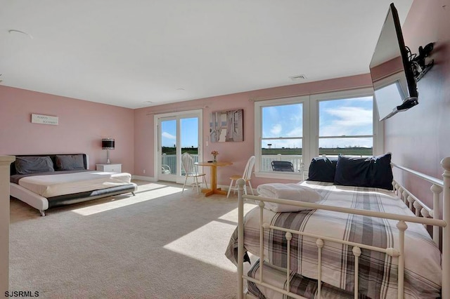 bedroom featuring carpet flooring and access to outside