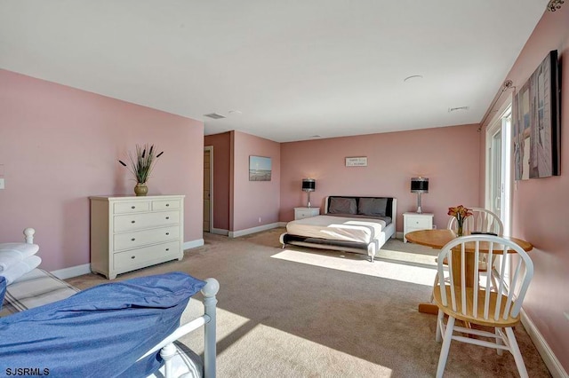 bedroom with light colored carpet