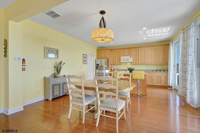 dining area featuring light hardwood / wood-style floors