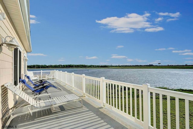 wooden deck with a water view