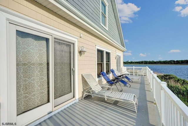 balcony featuring a water view