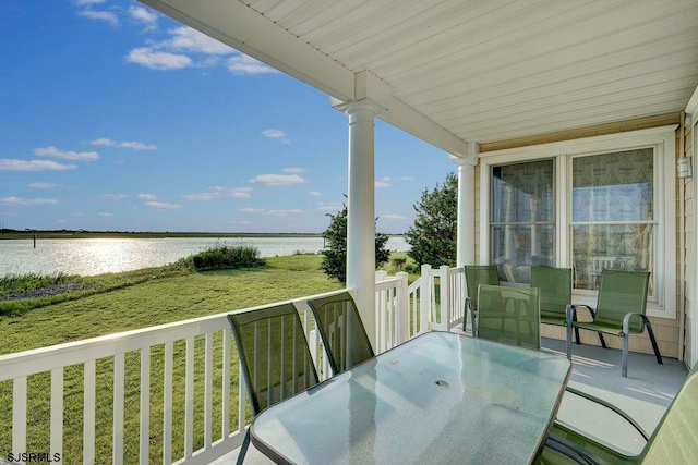 balcony featuring a water view