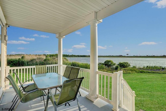 balcony featuring a water view