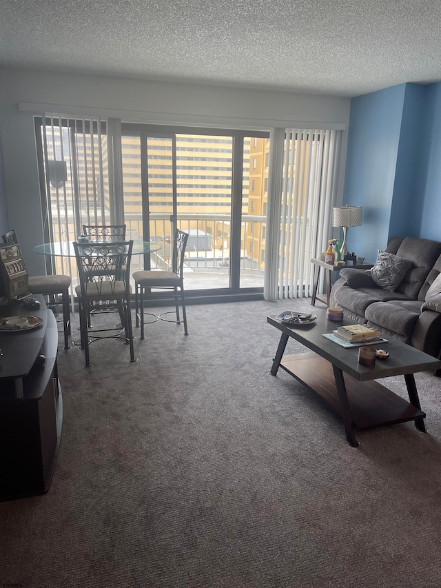 carpeted living room featuring a textured ceiling