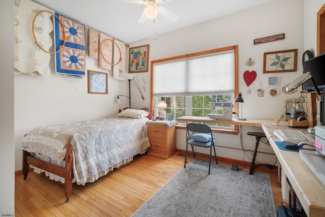 bedroom featuring light wood-type flooring and ceiling fan