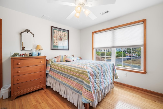 bedroom with ceiling fan and light hardwood / wood-style floors