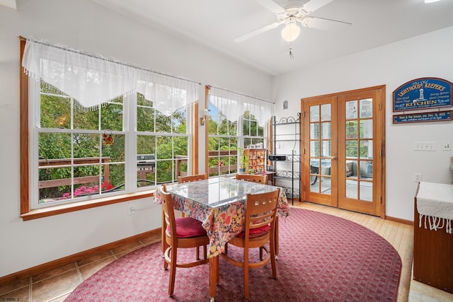 dining space featuring light hardwood / wood-style floors, ceiling fan, and french doors