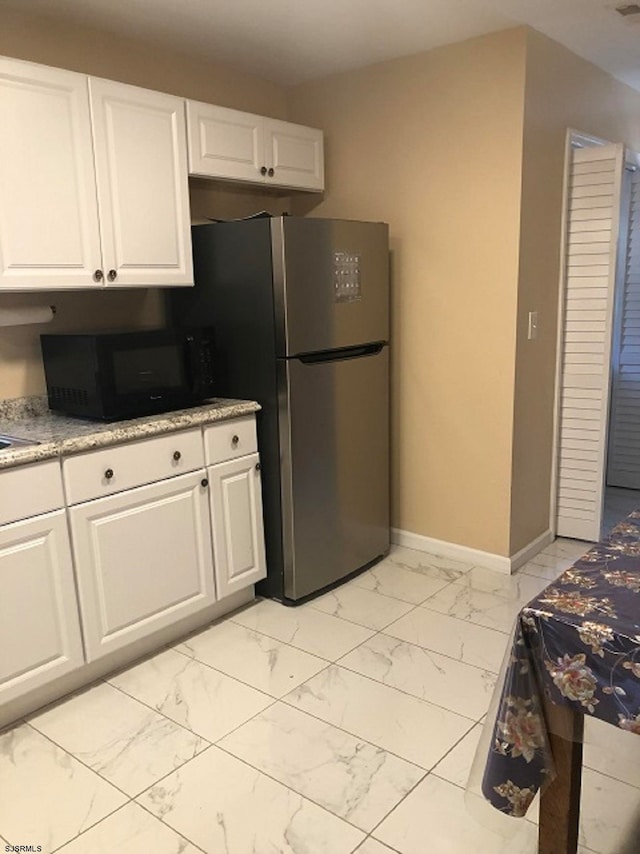 kitchen featuring white cabinetry