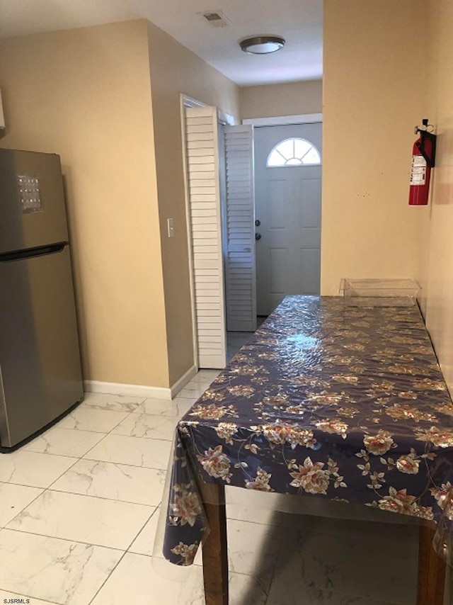 interior space featuring stainless steel fridge