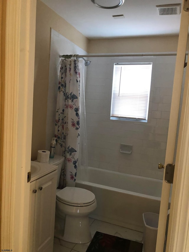 full bathroom with shower / bath combination with curtain, tile patterned floors, vanity, and toilet