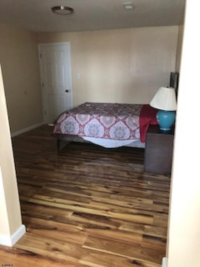 bedroom featuring hardwood / wood-style flooring