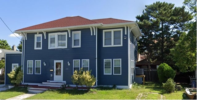 view of front of house with a front lawn and entry steps