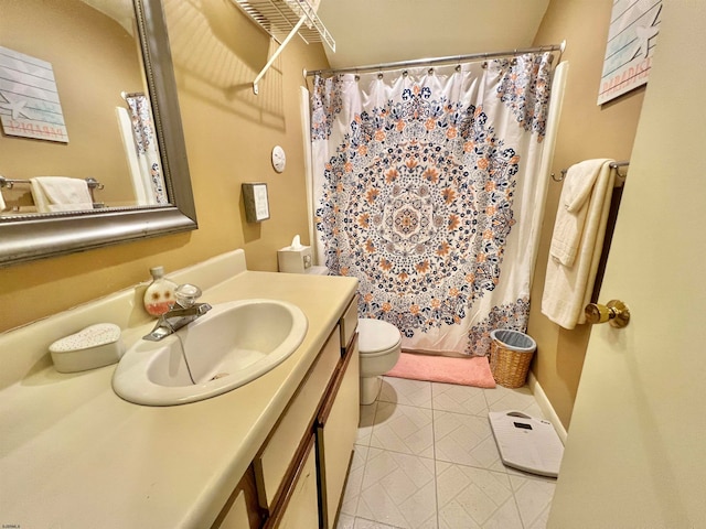 bathroom featuring tile patterned floors, a shower with curtain, vanity, and toilet