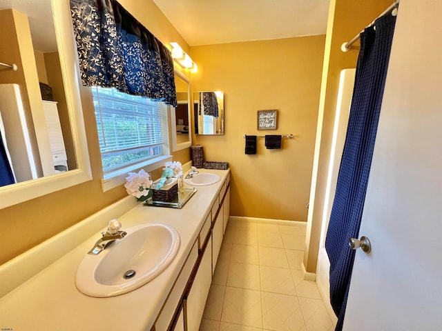 bathroom featuring tile patterned flooring and vanity