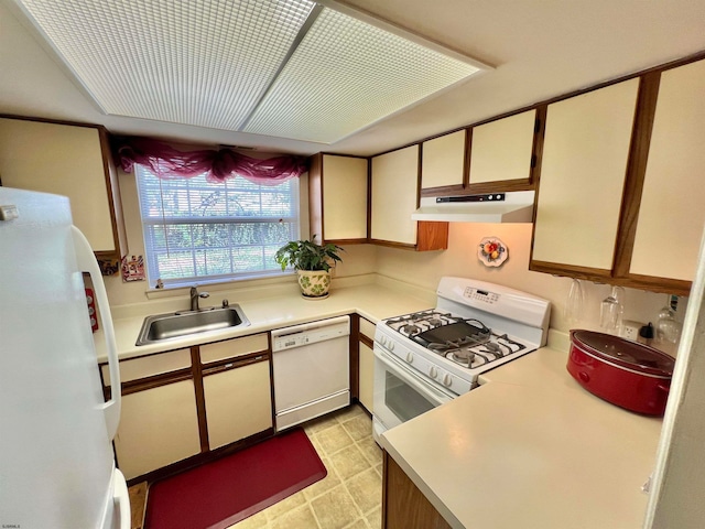 kitchen featuring white appliances and sink