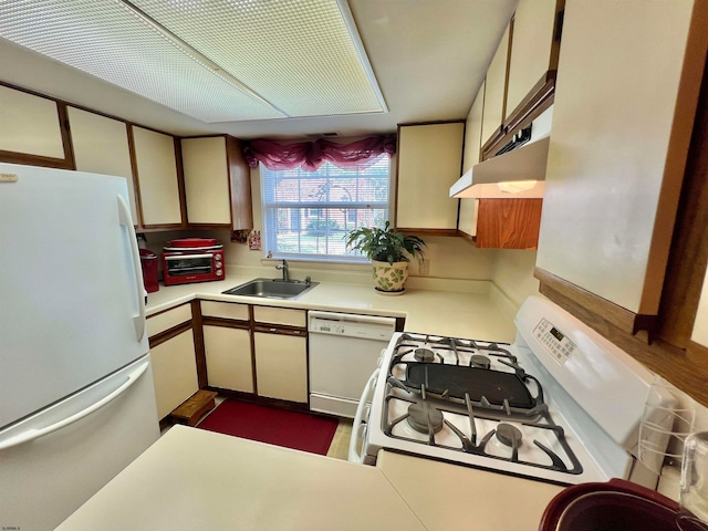 kitchen with white appliances and sink