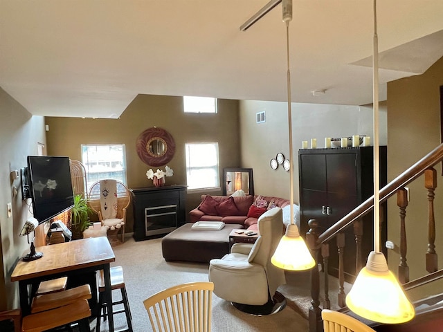 carpeted living room featuring a wealth of natural light