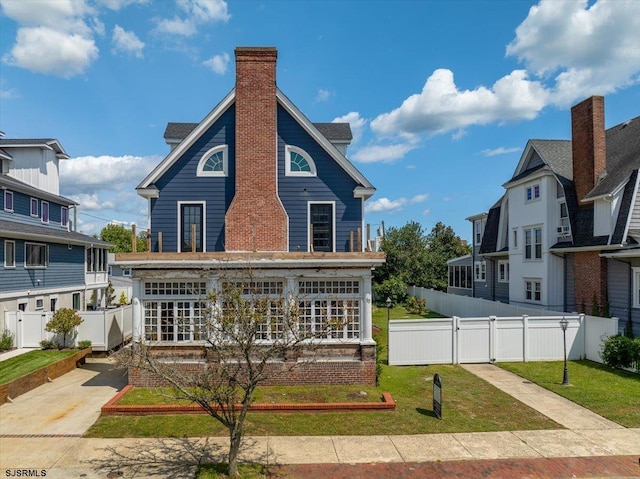 view of front of property with a front lawn