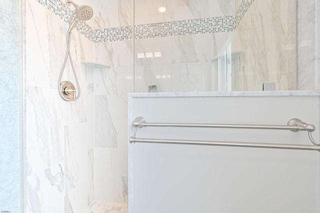 bathroom with a tile shower