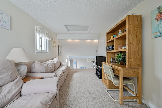 interior space with a textured ceiling and carpet