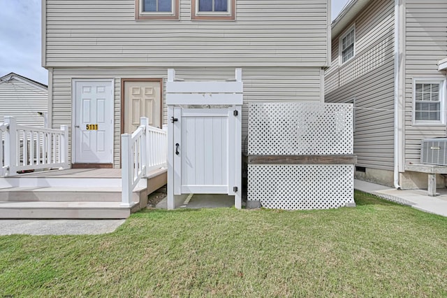 deck with a lawn and central AC