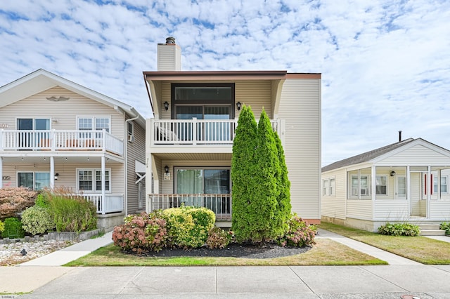 view of front of home with a balcony