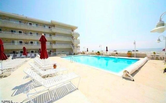 view of pool with a patio