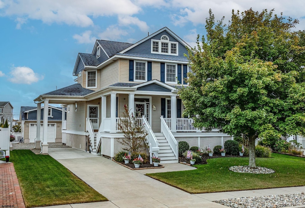 view of front facade with covered porch and a front yard