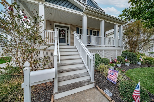 view of exterior entry featuring a porch