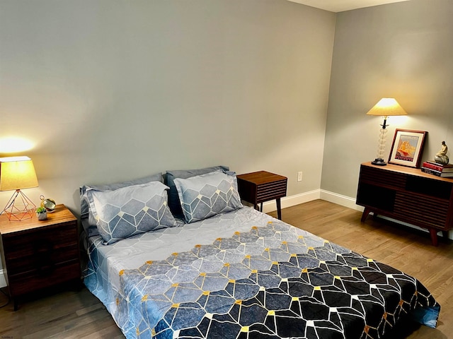 bedroom featuring hardwood / wood-style flooring