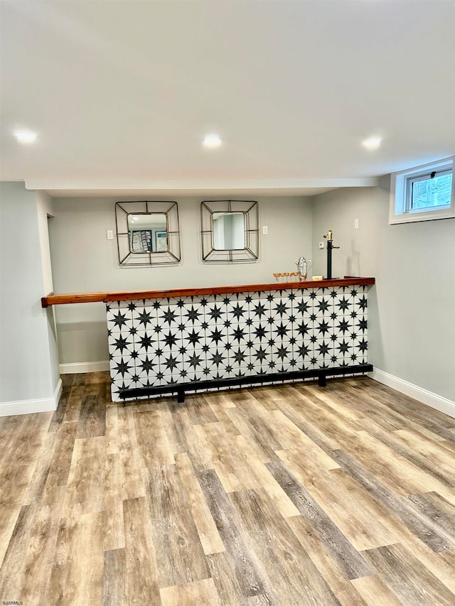 bar featuring hardwood / wood-style flooring