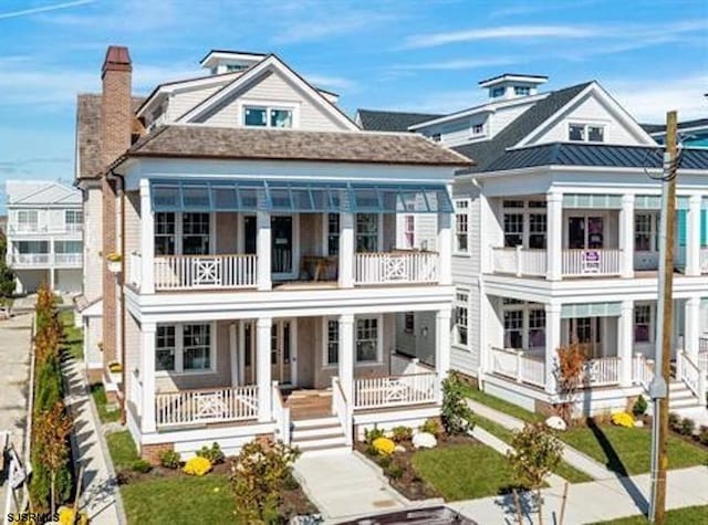 view of front of home with a balcony and covered porch