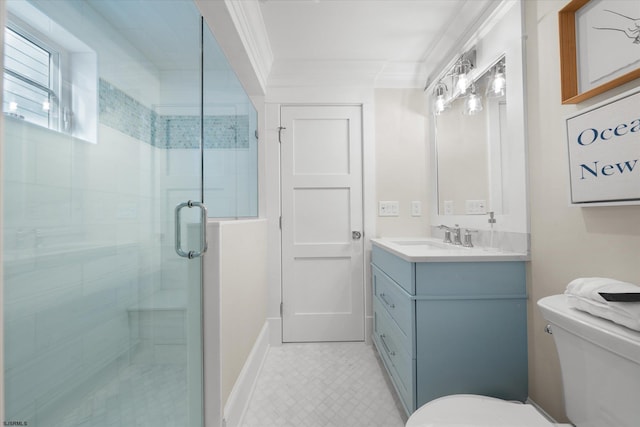 bathroom with vanity, a shower with shower door, toilet, and crown molding